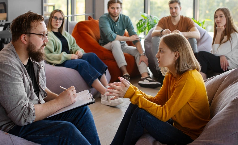 session counselor interviewing one of the members