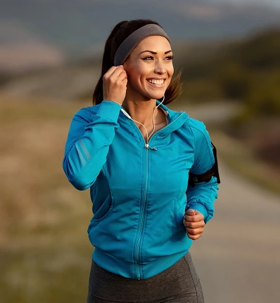 woman running in blue windbreaker jacket